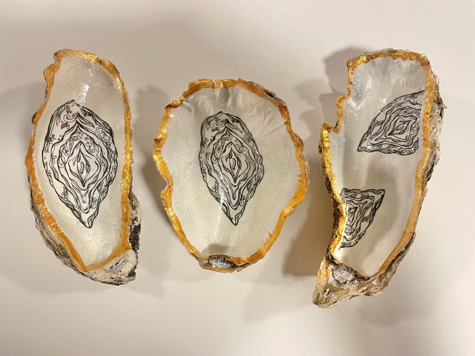 Jewelry dish made of oyster shell with vulva design