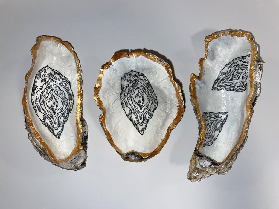 Jewelry dish made of oyster shell with vulva design